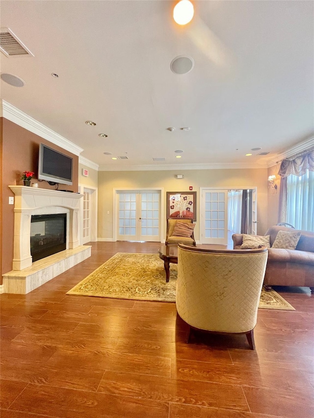 936 Tower Ridge Cir, Middletown, NY 10941 - living area featuring wood finished floors, a glass covered fireplace, crown molding, and recessed lighting