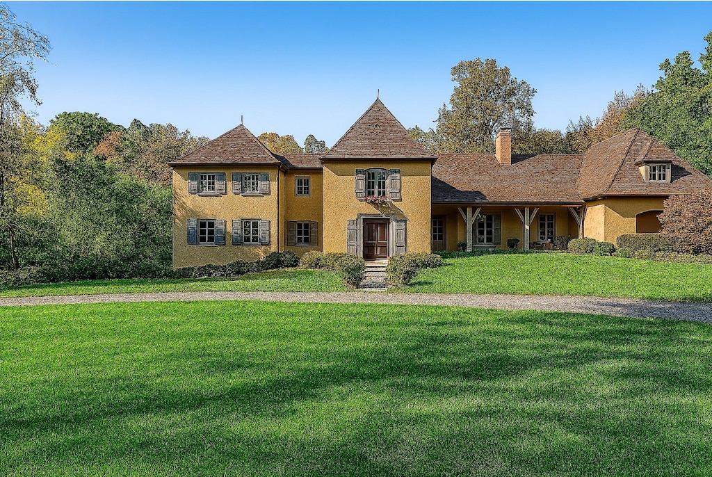 41 Linden Ln, Bedford Corners, NY 10549 - french country inspired facade featuring a front yard, a chimney, and stucco siding