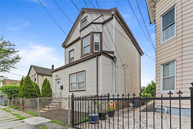 122 S High St, Mount Vernon, NY 10550 - view of side of property featuring a fenced front yard and a gate
