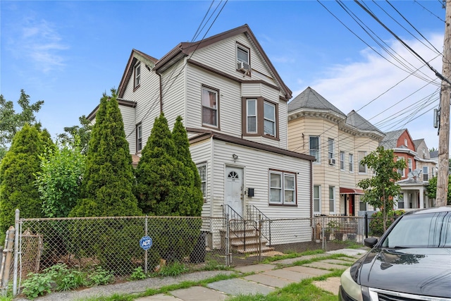 122 S High St, Mount Vernon, NY 10550 - victorian-style house with entry steps, a fenced front yard, and a gate