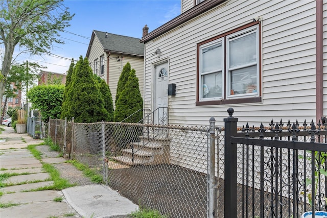 122 S High St, Mount Vernon, NY 10550 - view of side of property with a fenced front yard and a gate
