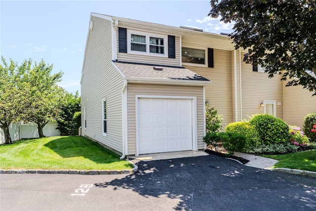 100 Baker Ct Unit 128, Island Park, NY 11558 - traditional-style home featuring asphalt driveway and a shingled roof