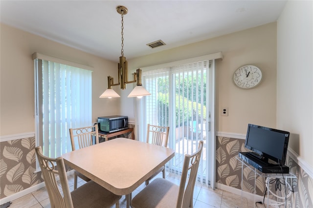 100 Baker Ct Unit 128, Island Park, NY 11558 - dining room with light tile patterned flooring