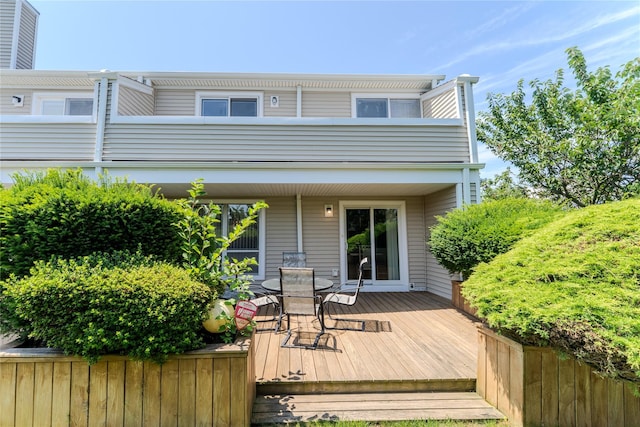 100 Baker Ct Unit 128, Island Park, NY 11558 - wooden terrace featuring outdoor dining area