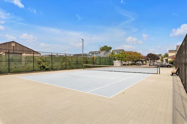 100 Baker Ct Unit 128, Island Park, NY 11558 - view of tennis court with community basketball court