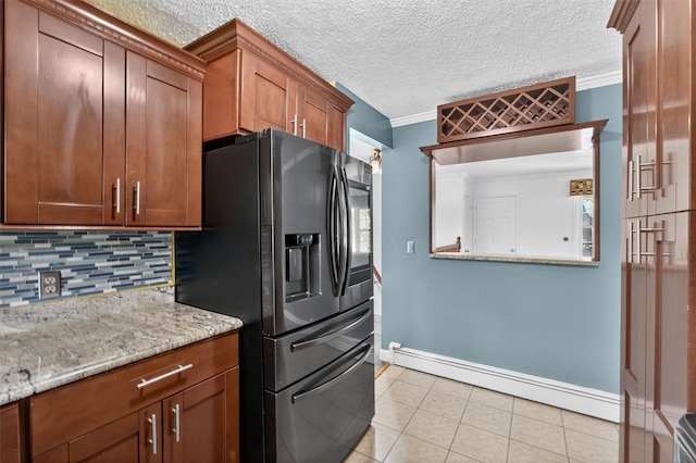 2710 S Rd Unit A4, Poughkeepsie, NY 12601 - kitchen featuring a baseboard radiator, black fridge, backsplash, light tile patterned flooring, and ornamental molding