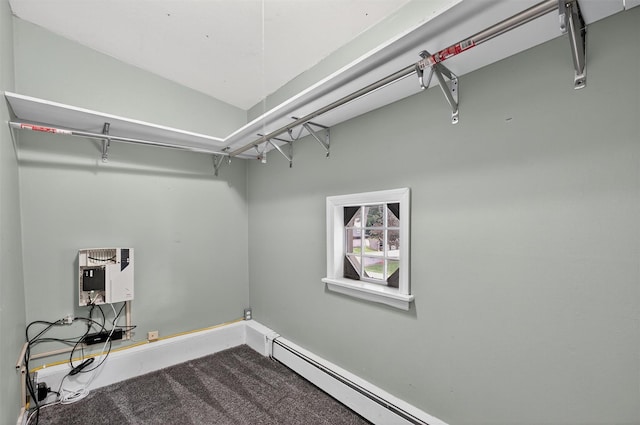 2710 S Rd Unit A4, Poughkeepsie, NY 12601 - laundry area with baseboard heating, heating unit, and carpet