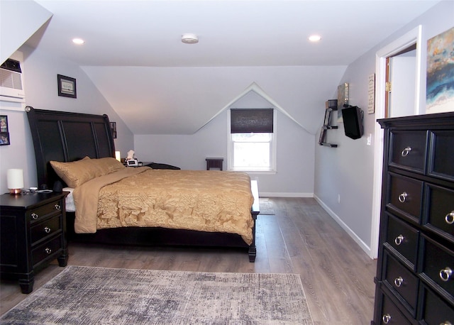73 Peconic St, Selden, NY 11784 - bedroom featuring wood finished floors, vaulted ceiling, and recessed lighting