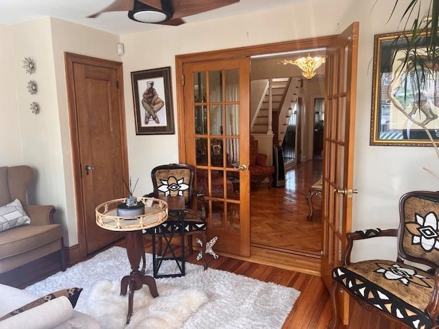 1607 E 43rd St, Brooklyn, NY 11234 - living area with stairway, wood finished floors, and a ceiling fan