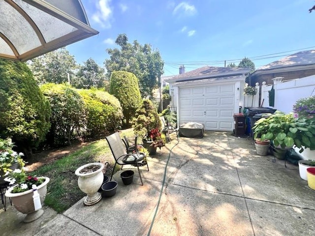 1607 E 43rd St, Brooklyn, NY 11234 - view of patio / terrace with driveway and an outdoor structure