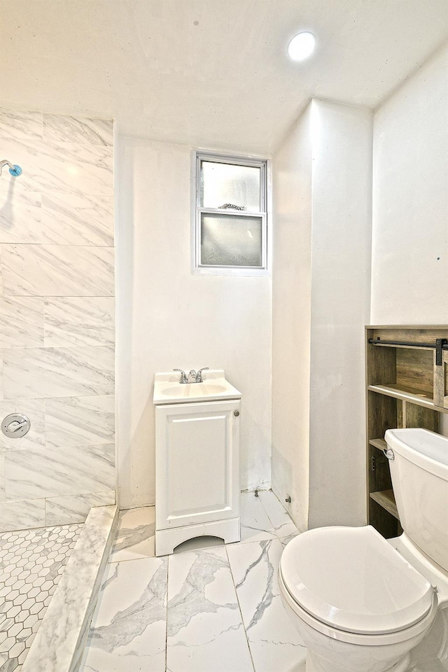 5822 Penrod St, Corona, NY 11368 - bathroom featuring marble finish floors, a tile shower, and vanity