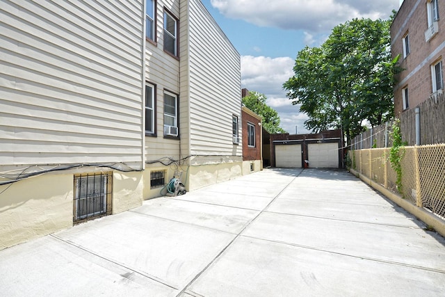 5822 Penrod St, Corona, NY 11368 - view of home's exterior with a detached garage