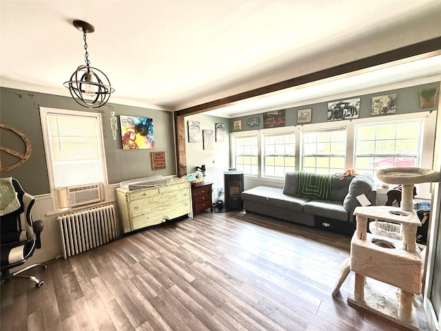 61 Cottage St, Roscoe, NY 12776 - living room featuring radiator, wood finished floors, a chandelier, and beam ceiling