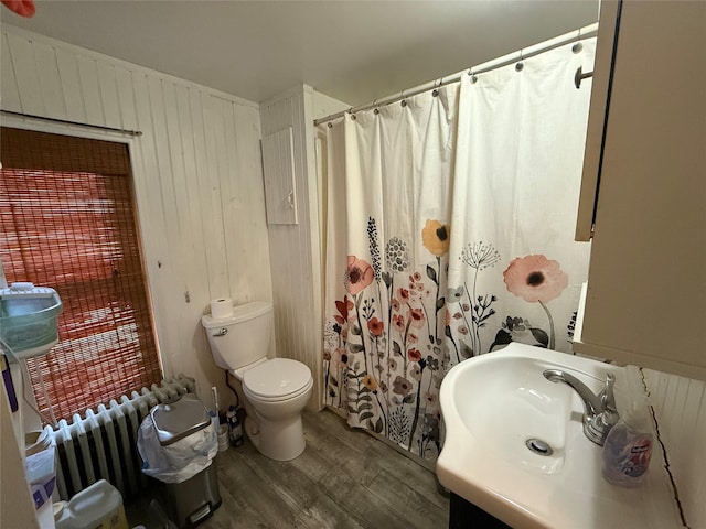 61 Cottage St, Roscoe, NY 12776 - bathroom featuring wood finished floors, radiator, vanity, wooden walls, and curtained shower