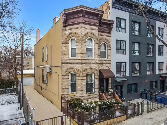 65 Granite St, Brooklyn, NY 11207 - view of building exterior featuring a fenced front yard