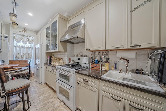 65 Granite St, Brooklyn, NY 11207 - kitchen with wall chimney exhaust hood, white appliances, tasteful backsplash, glass insert cabinets, and dark stone counters