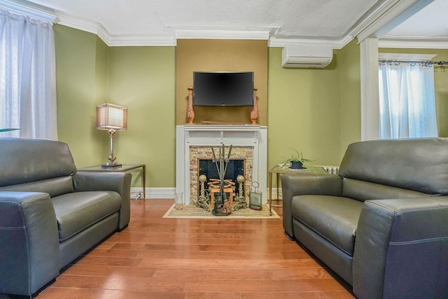 65 Granite St, Brooklyn, NY 11207 - sitting room with crown molding, wood finished floors, a fireplace, and a wall mounted air conditioner