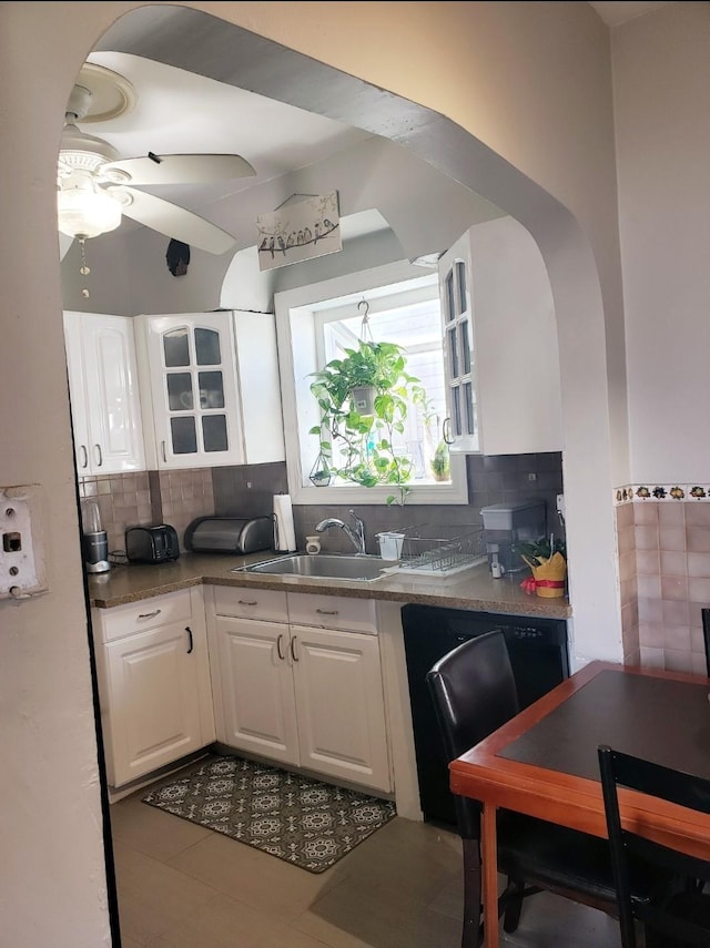 269 Windsor Pkwy, Hempstead, NY 11550 - kitchen with white cabinets, ceiling fan, backsplash, and dark countertops