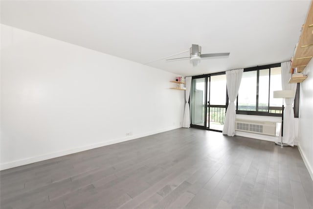 152-18 Union Tpke Unit 12T, Flushing, NY 11367 - unfurnished room with dark wood finished floors, ceiling fan, and floor to ceiling windows