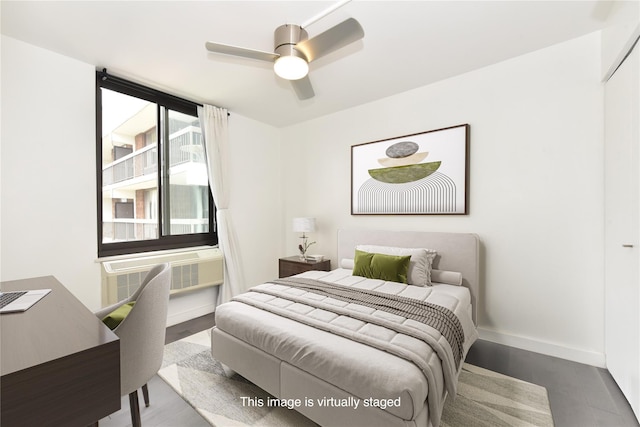 152-18 Union Tpke Unit 12T, Flushing, NY 11367 - bedroom with wood finished floors, a wall mounted air conditioner, and ceiling fan
