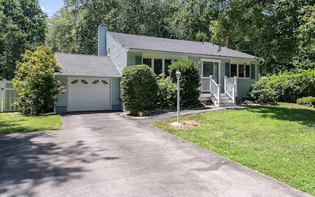 3 N Jackson Rd, Poughkeepsie, NY 12603 - ranch-style home with a chimney, asphalt driveway, a front yard, an attached garage, and roof with shingles