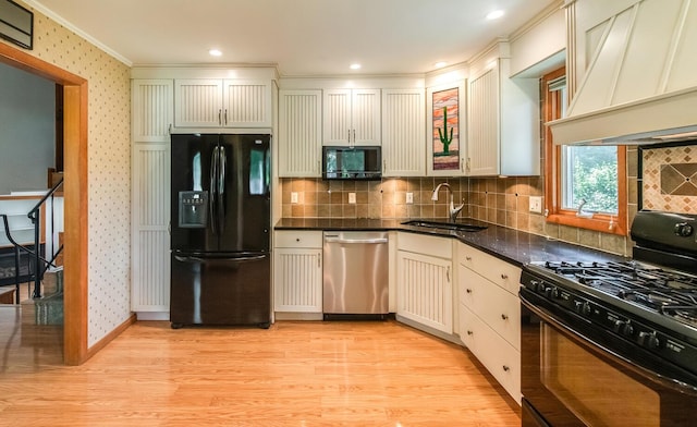 3 N Jackson Rd, Poughkeepsie, NY 12603 - kitchen with black appliances, custom exhaust hood, wallpapered walls, light wood-type flooring, and crown molding