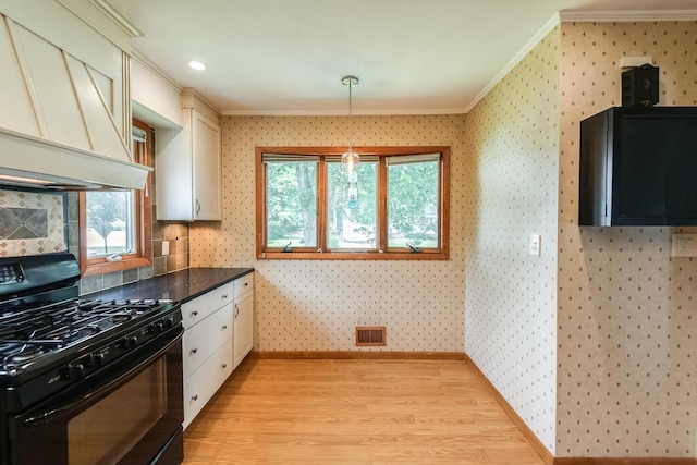 3 N Jackson Rd, Poughkeepsie, NY 12603 - kitchen featuring black gas range oven, ornamental molding, wallpapered walls, light wood-style floors, and dark countertops
