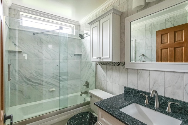 3 N Jackson Rd, Poughkeepsie, NY 12603 - bathroom featuring bath / shower combo with glass door, vanity, tile walls, ornamental molding, and decorative backsplash