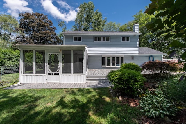 3 N Jackson Rd, Poughkeepsie, NY 12603 - rear view of property with a chimney, a sunroom, and a wooden deck