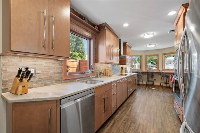 8 Pearl St, Bethpage, NY 11714 - kitchen featuring appliances with stainless steel finishes, dark wood finished floors, plenty of natural light, decorative backsplash, and recessed lighting