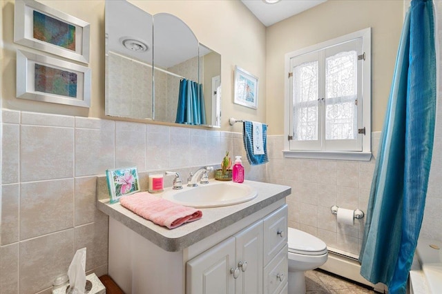 8 Pearl St, Bethpage, NY 11714 - bathroom featuring tile walls, vanity, curtained shower, wainscoting, and tile patterned floors