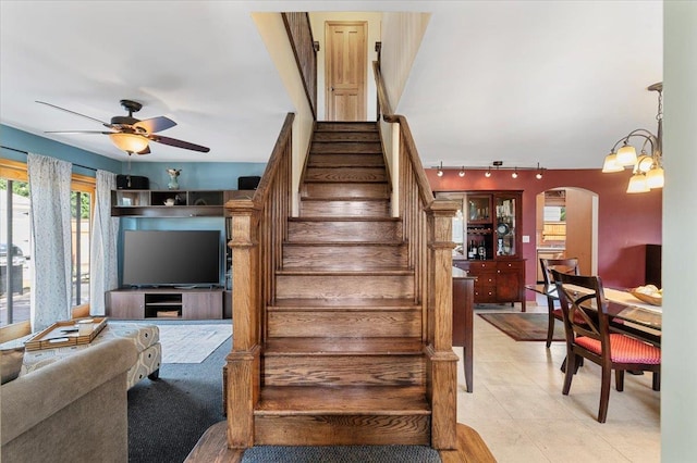 8 Pearl St, Bethpage, NY 11714 - stairs with rail lighting, a ceiling fan, and arched walkways