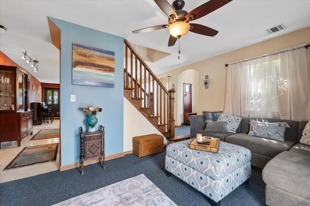 8 Pearl St, Bethpage, NY 11714 - living room with arched walkways, stairway, a ceiling fan, rail lighting, and carpet floors