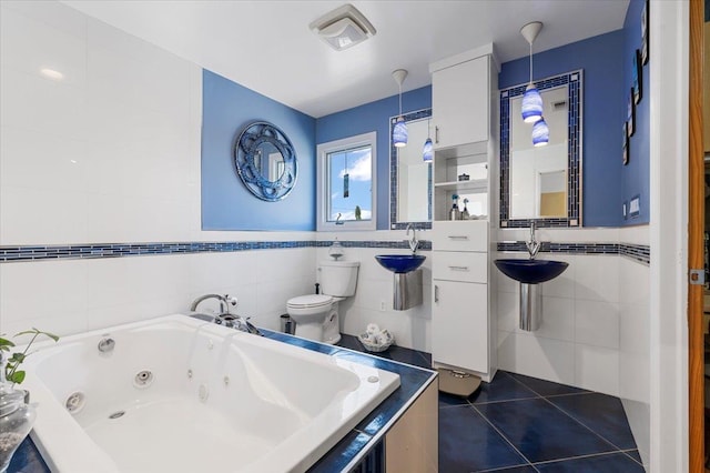 8 Pearl St, Bethpage, NY 11714 - bathroom with tile walls, a whirlpool tub, and tile patterned floors