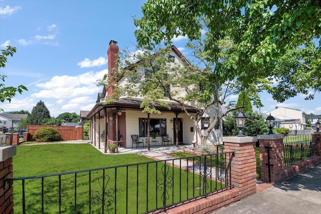8 Pearl St, Bethpage, NY 11714 - rear view of property with covered porch, a fenced front yard, and a chimney