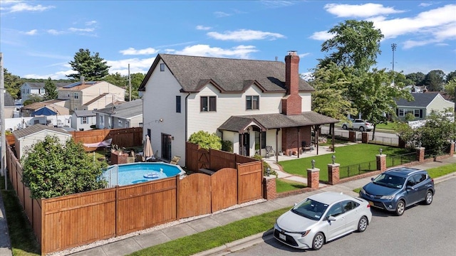 8 Pearl St, Bethpage, NY 11714 - view of front facade with a fenced front yard, a gate, and a residential view