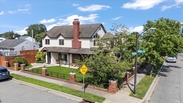 8 Pearl St, Bethpage, NY 11714 - view of front facade with a fenced front yard, roof with shingles, a chimney, and covered porch