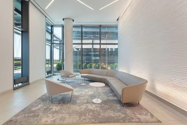 131-05 40th Rd Unit 17L, Flushing, NY 11354 - community lobby featuring expansive windows and a high ceiling