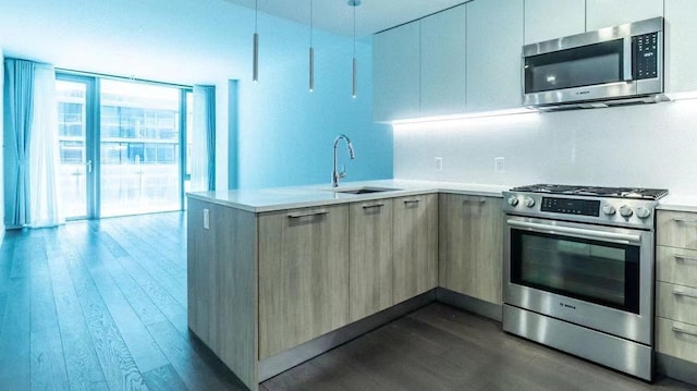 131-05 40th Rd Unit 17L, Flushing, NY 11354 - kitchen featuring appliances with stainless steel finishes, modern cabinets, dark wood-style floors, and light countertops