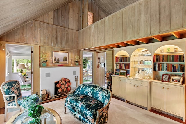 22 Turtle Cove Dr, Southampton, NY 11968 - sitting room featuring wood walls, wood ceiling, high vaulted ceiling, and built in shelves