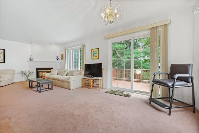 1105 Farmdale Rd, Brewster, NY 10509 - carpeted living area with a glass covered fireplace and a chandelier