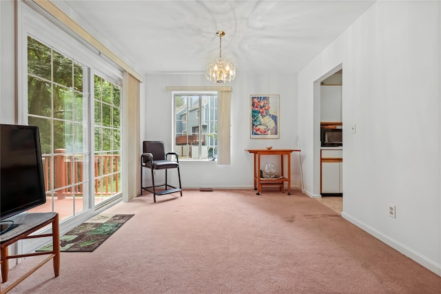1105 Farmdale Rd, Brewster, NY 10509 - sitting room with carpet floors and a chandelier