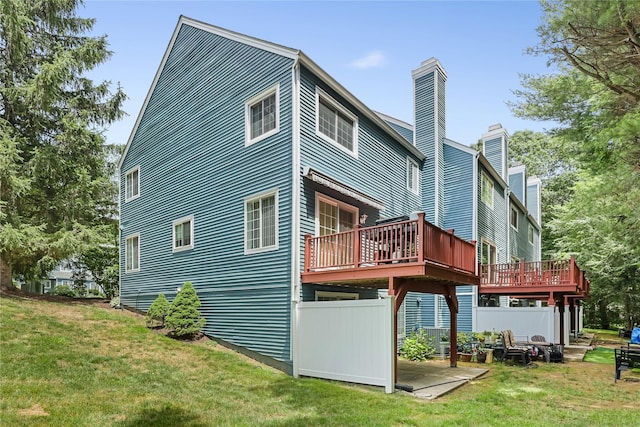 1105 Farmdale Rd, Brewster, NY 10509 - back of property with a chimney, a yard, and a deck