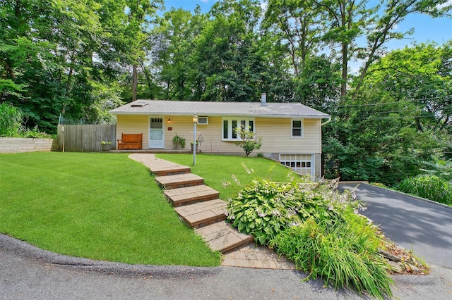 69 Floradan Rd, Putnam Valley, NY 10579 - view of front of property with a garage, driveway, and view of scattered trees