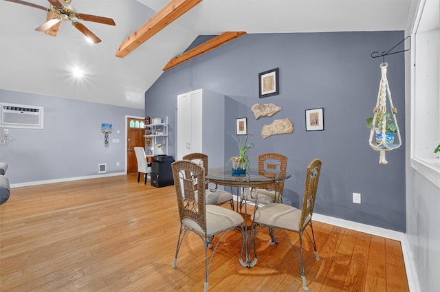 69 Floradan Rd, Putnam Valley, NY 10579 - dining room with an AC wall unit, ceiling fan, light wood finished floors, high vaulted ceiling, and beam ceiling