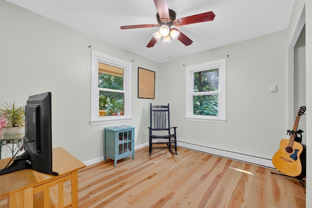 69 Floradan Rd, Putnam Valley, NY 10579 - interior space featuring healthy amount of natural light, light wood-style floors, a baseboard heating unit, and a ceiling fan