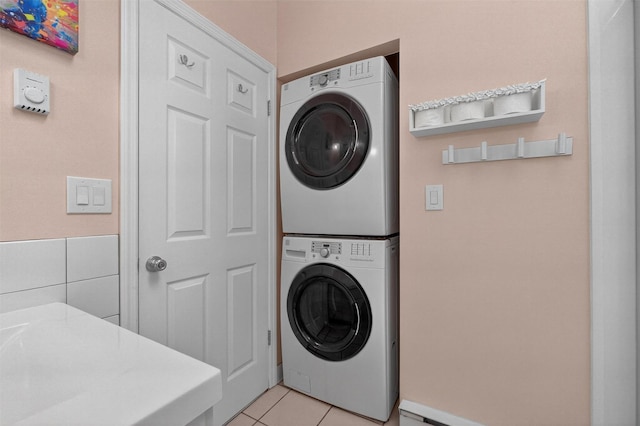 69 Floradan Rd, Putnam Valley, NY 10579 - washroom with stacked washer and clothes dryer and light tile patterned floors