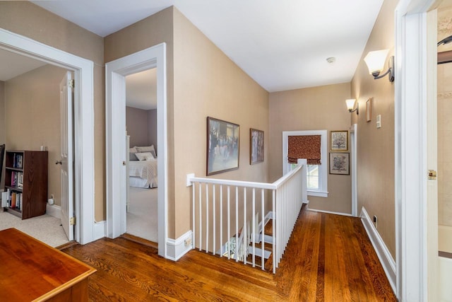 11 Loel Ct, Rockville Centre, NY 11570 - hallway with an upstairs landing and wood finished floors