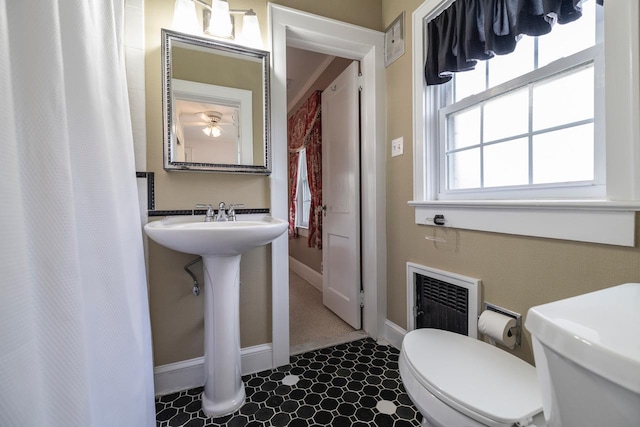 11 Loel Ct, Rockville Centre, NY 11570 - bathroom featuring heating unit and curtained shower