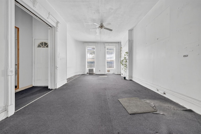 17 Palmetto St, Brooklyn, NY 11221 - empty room with a ceiling fan and carpet flooring